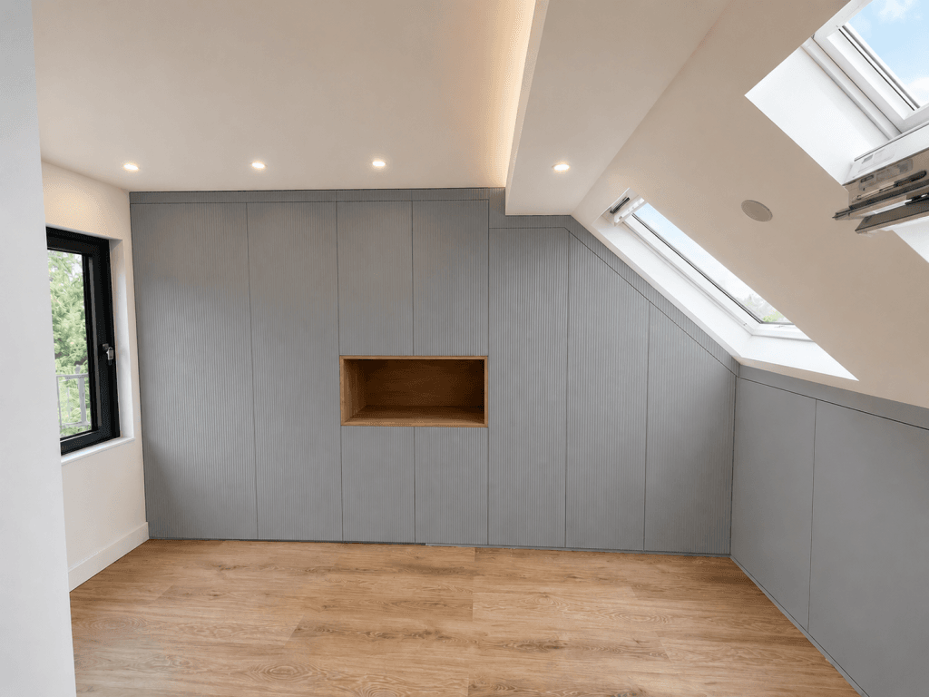 Modern Velux loft conversion with bespoke fitted storage and skylight windows